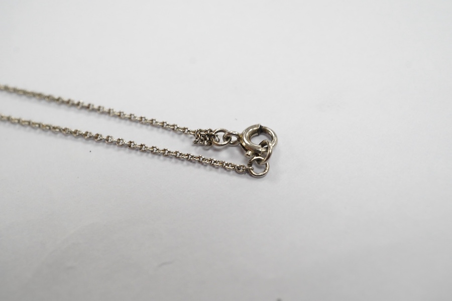 A two stone diamond articulated pendant, on a fine white metal chain. Condition - fair